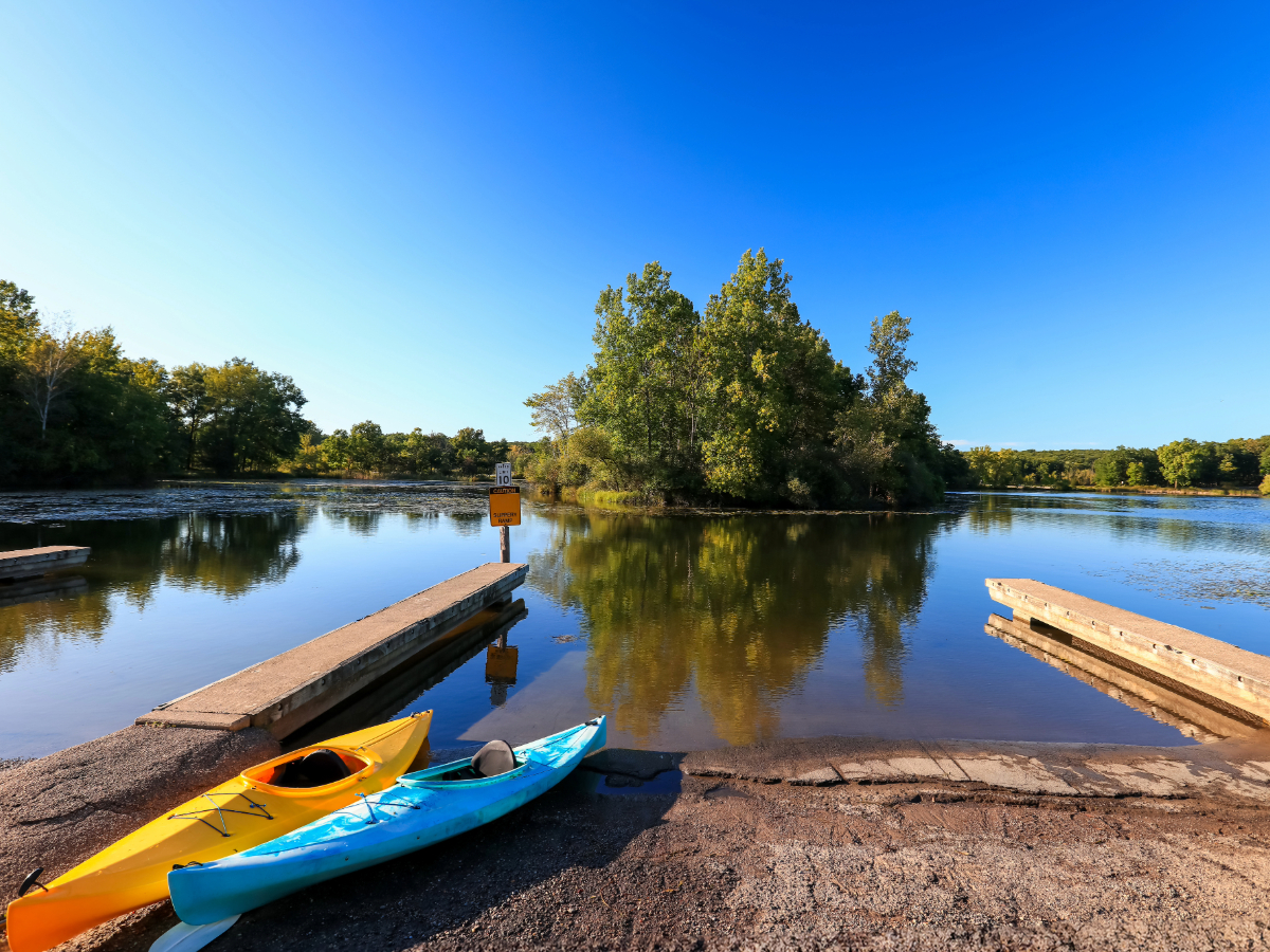 Picture of kayaks on bank of Blue Lake for article Fairview for newcomers moving to Portland.