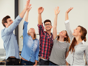 Coworkers cheering.