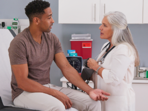 Primary Care Physician taking care of patient.