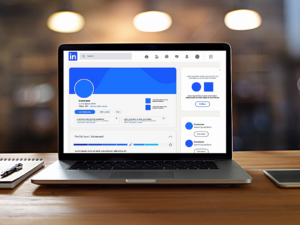 Laptop computer with blank LinkedIn page on screen.