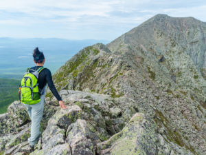 Girl hiking on ridgeline of Portland mountains for article 5 Unforgettable Outdoor Adventures in Portland for Newcomers moving to Portland.